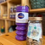 The Cellar Trust Donation Shaker and Jar with Money in